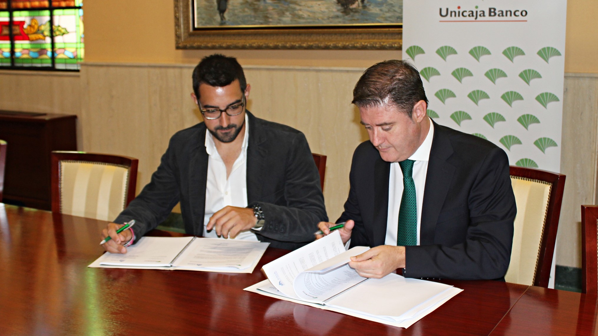 firma convenio Unicaja Banco ACIA